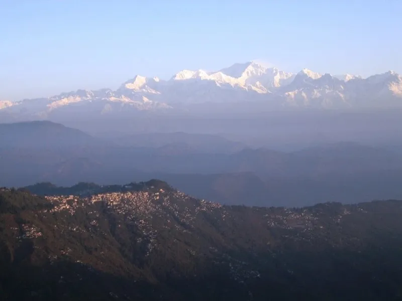 Tiger Hill offers a breathtaking panoramic view of the Kanchenjunga mountain ranges and the serene Darjeeling city, a must-visit for nature enthusiasts.
