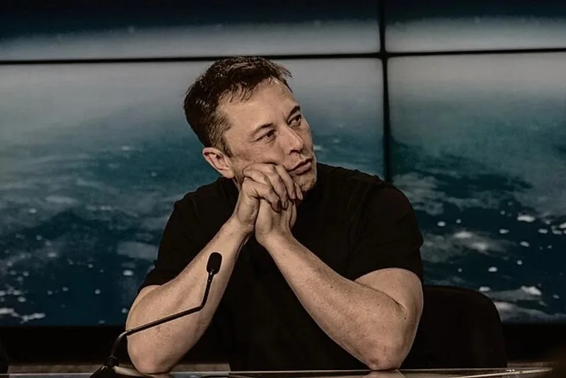 Elon Musk speaking at a press conference, sharing his visionary ideas and insights on technology, innovation, and the future of business.